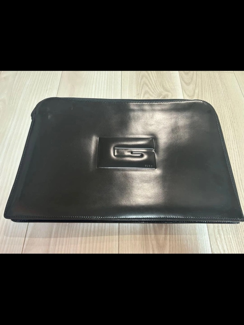 Gucci Black Leather Clutch with Embossed Logo